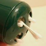 Re-use a toothbrush holder as a cotton swab dispenser