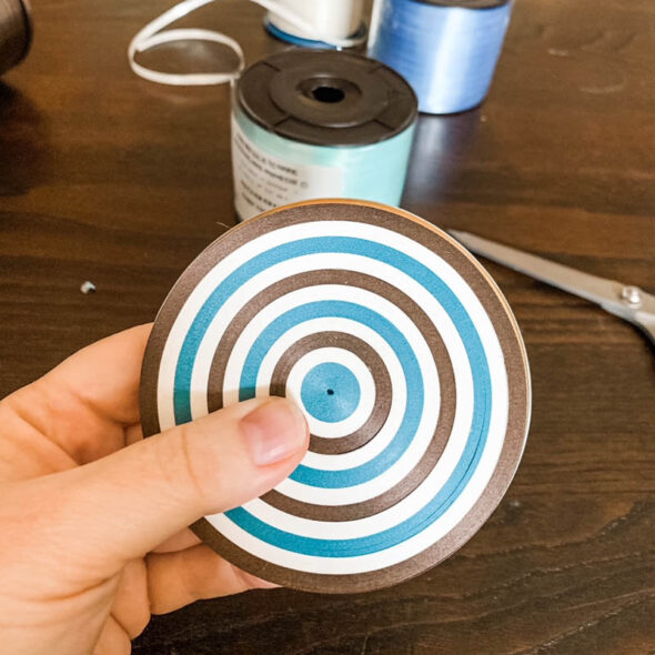 Make coasters from curling ribbon