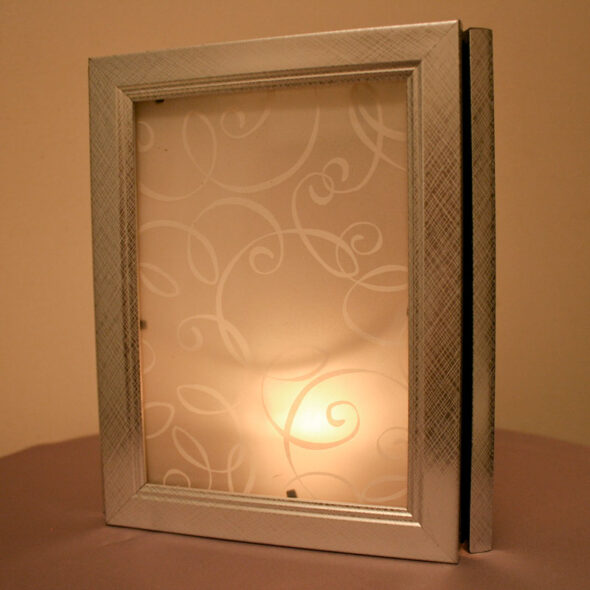 DIY wedding luminaria centerpieces from dollar store frames and printed vellum