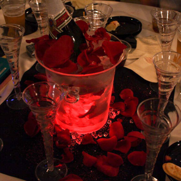 Champagne wedding centerpiece with lights and roses