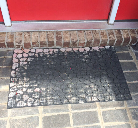 Use paint to revive a worn out door mat