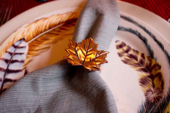 Feathers and metallics for a Thanksgiving table setting