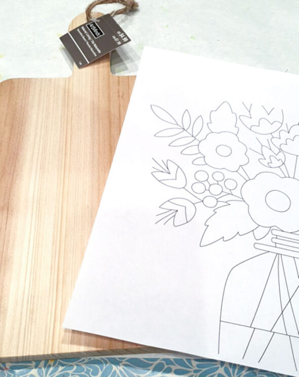Wood-burning designs onto a cutting board