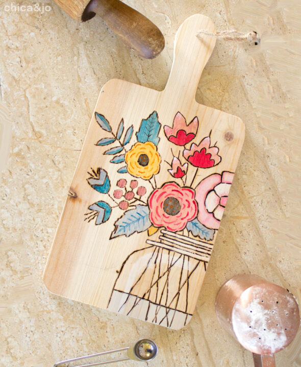 Wood-burning designs onto a cutting board