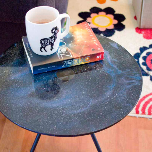 Galaxy Print Paint Pour on a Glass Table