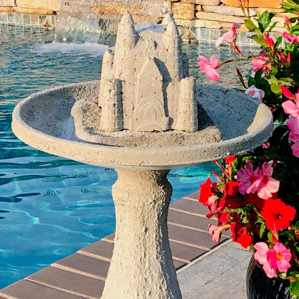 Cast concrete sandcastle fountain bird bath