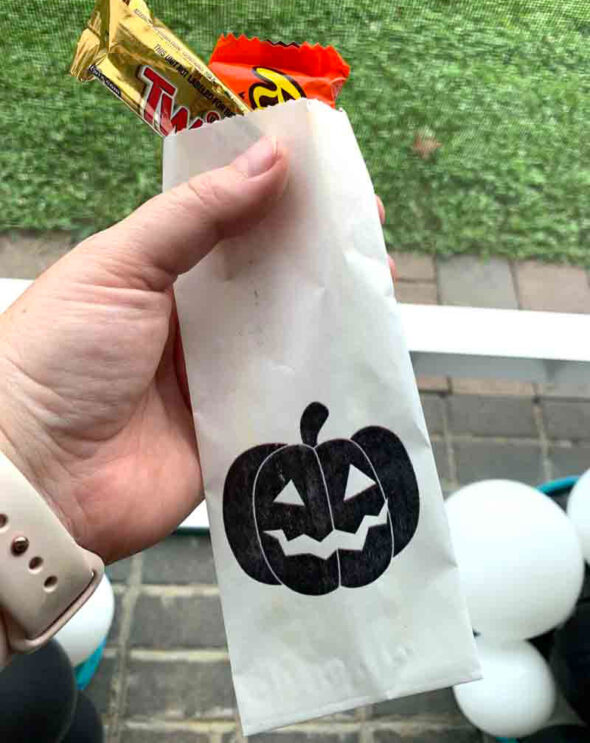Self-serve Halloween trick-or-treat candy station with Teal Pumpkin Project favors