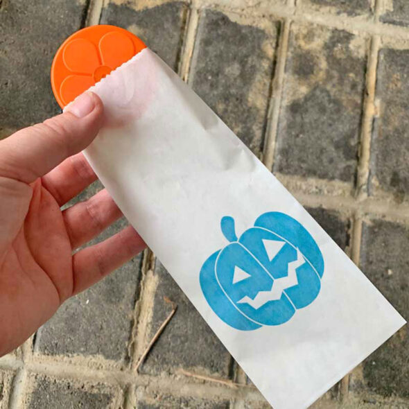Self-serve Halloween trick-or-treat candy station with Teal Pumpkin Project favors