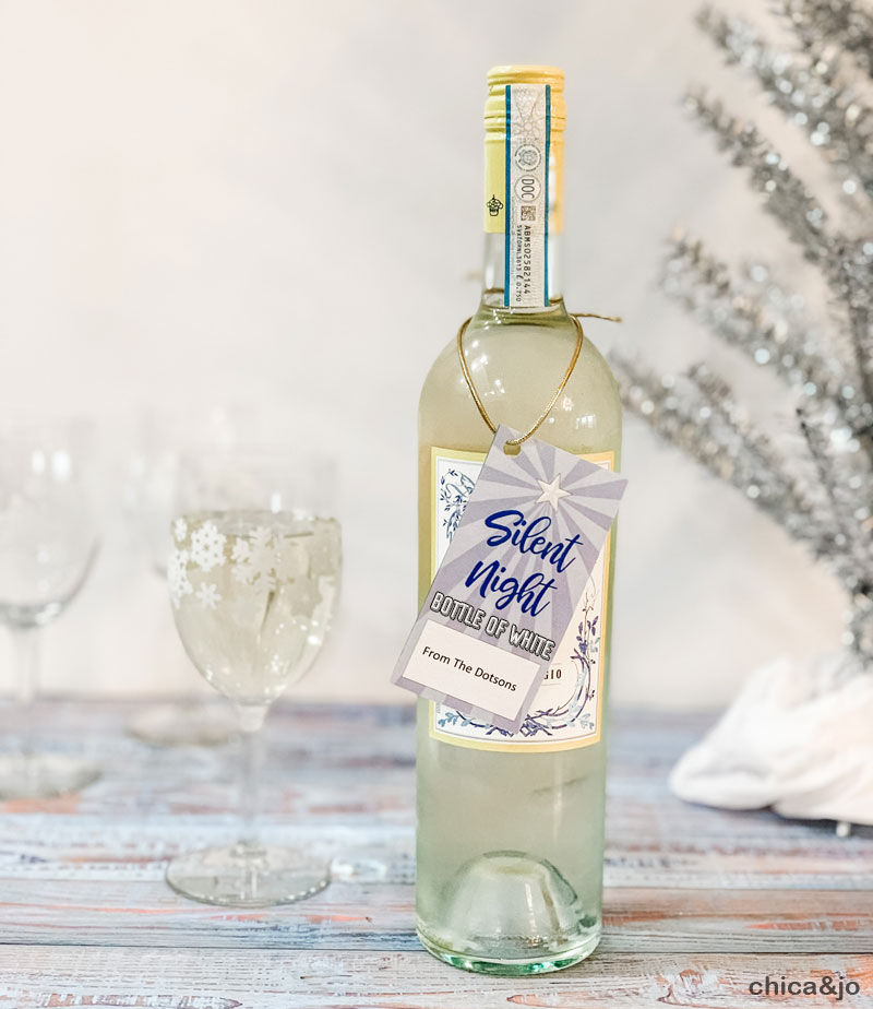 https://www.chicaandjo.com/wp-content/uploads/2020/12/seven-neighbor-coworker-gifts-ideas-silent-night-bottle-of-white-wine.jpg