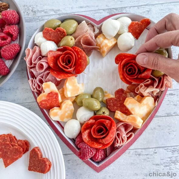 Valentine's Day charcuterie board in a heart-shaped candy box