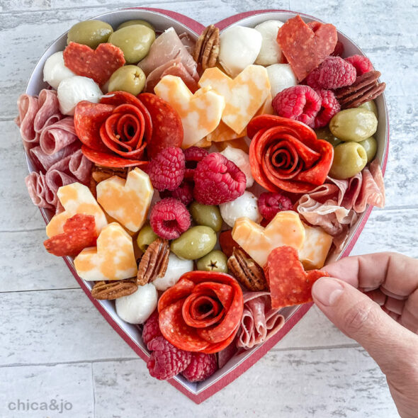 Valentine's Day charcuterie board in a heart-shaped candy box