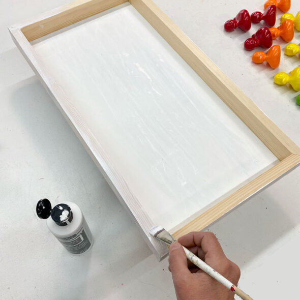 Rainbow kid's bathroom art from painted toy ducks