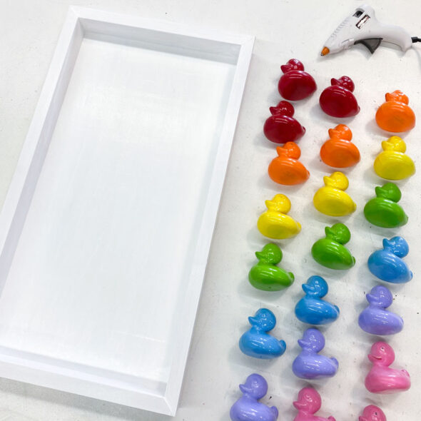 Rainbow kid's bathroom art from painted toy ducks