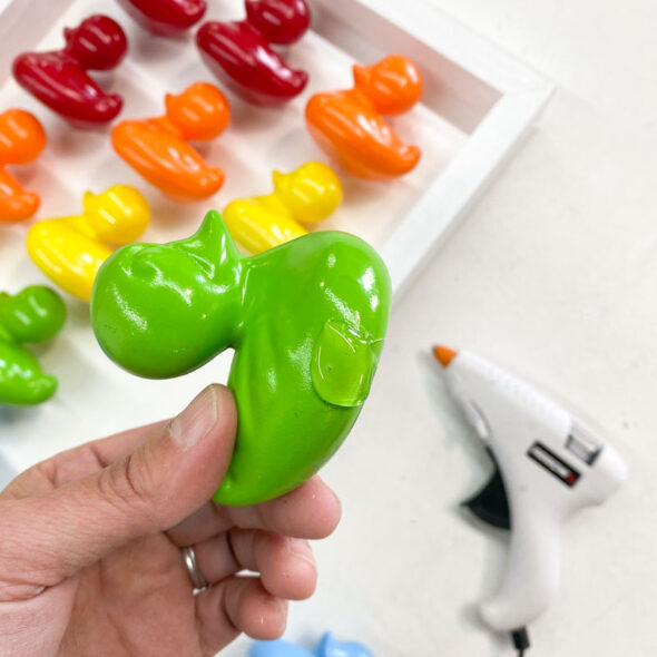 Rainbow kid's bathroom art from painted toy ducks