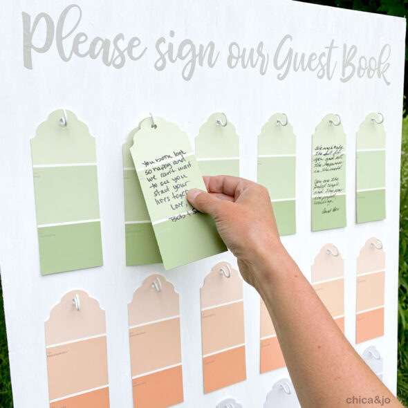 Alternative wedding guest book board with paint chip tags