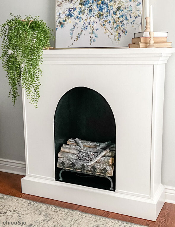 DIY faux fireplace made from an upcycled hutch