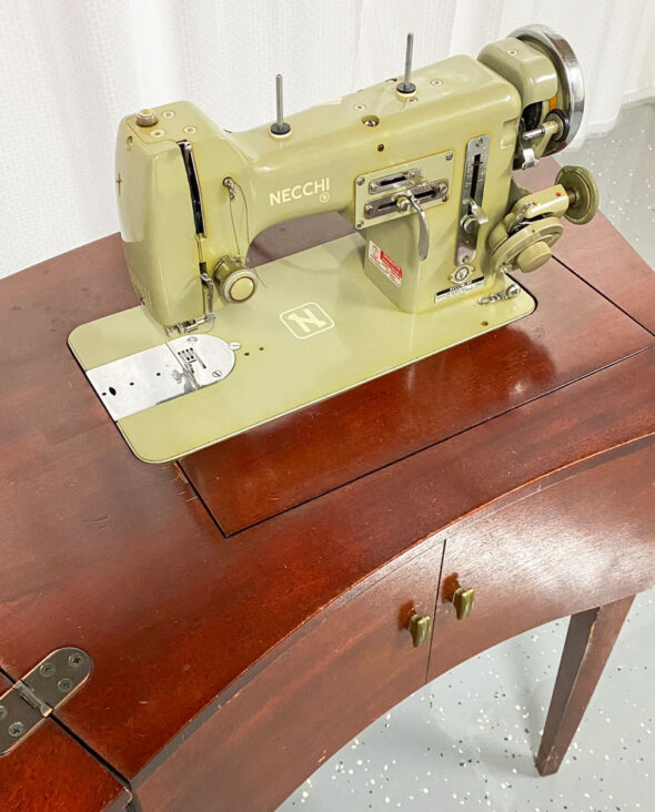 DIY bar cart from a vintage sewing machine cabinet