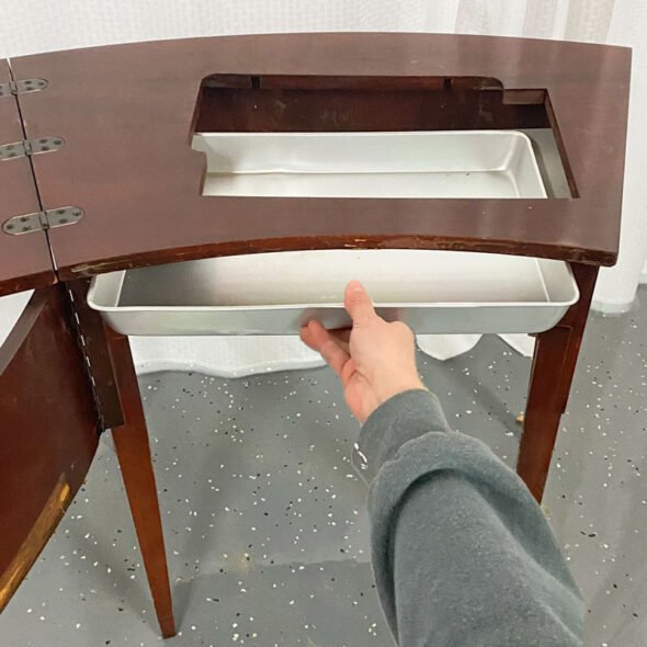 DIY bar cart from a vintage sewing machine cabinet