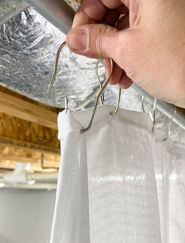 Easy custom sliding curtain divider for a storage area