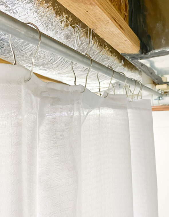 Easy custom sliding curtain divider for a storage area