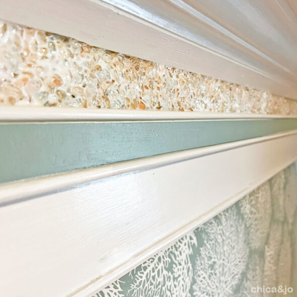 Turn a fireplace mantel into a headboard for coastal beach decor