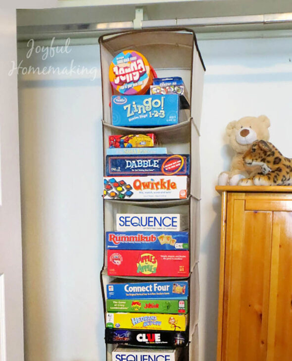 board game storage ideas - hanging sweater organizer