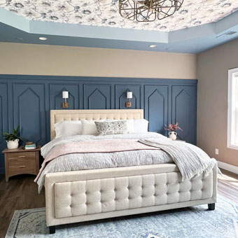 Bedroom with Accent Wall and Wallpapered Tray Ceiling
