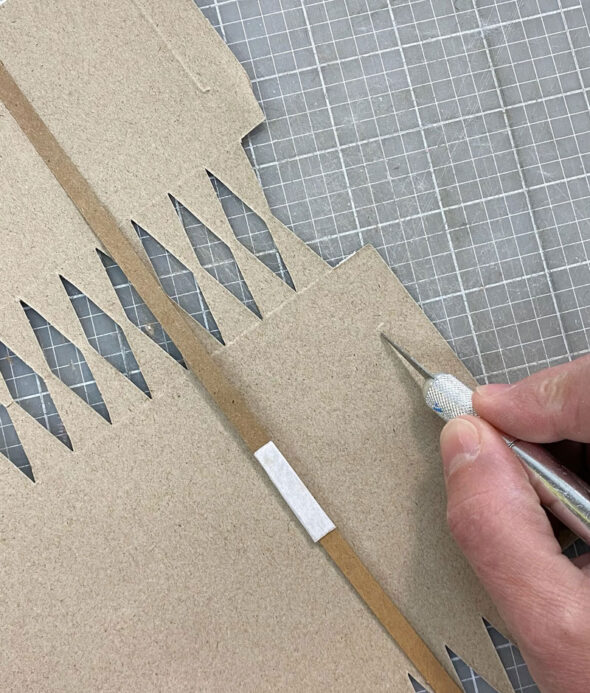 how to make christmas crackers easy - cut slot with knife