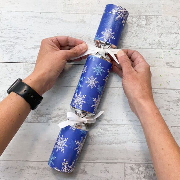 how to make christmas crackers easy - tie other end up with ribbon