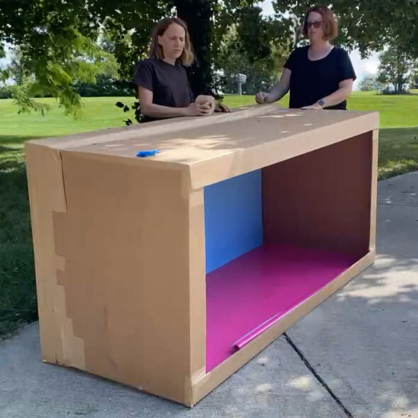 DIY Barbie box photo booth - sealing back panel onto box