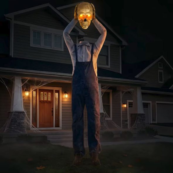 15 foot animatronic headless farmer with severed skull overhead
