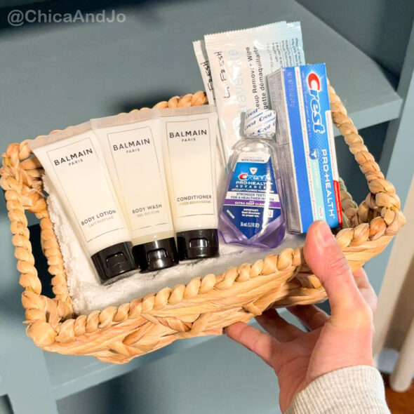 guest room essentials in a thrifted cabinet for amenities - extra toiletries