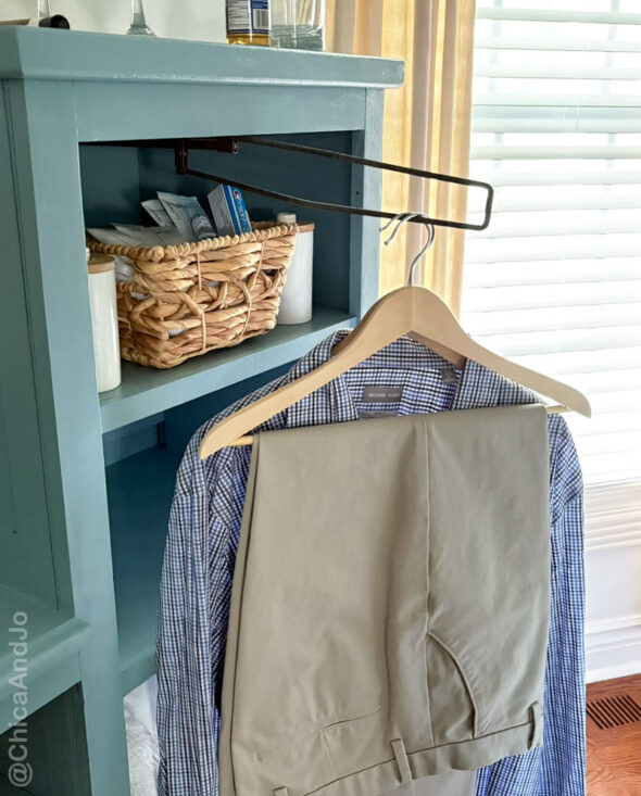 guest room essentials in a thrifted cabinet for amenities - somewhere to hang clothes